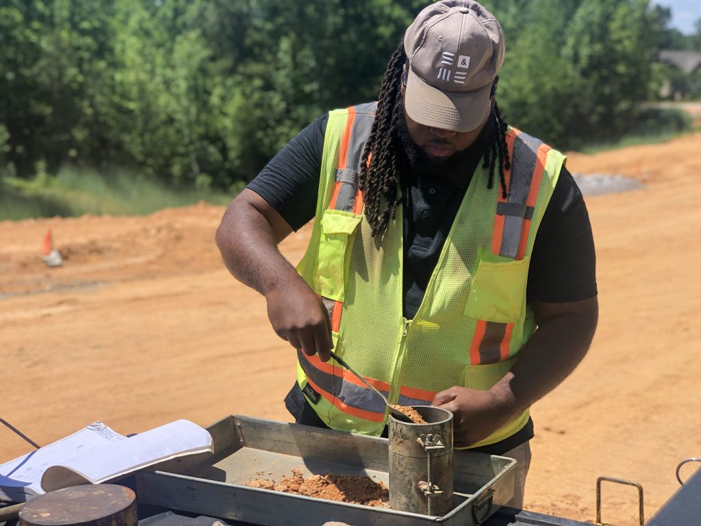 Technician tests soil for inspection service